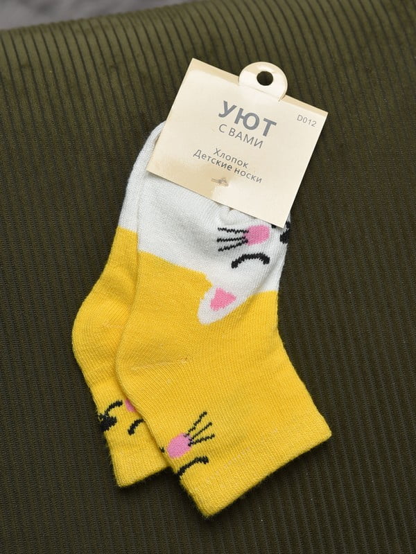 Шкарпетки жовтого кольору | 6685860