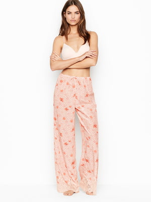 Штани піжамні рожевого кольору в квітковий принт | 5610573