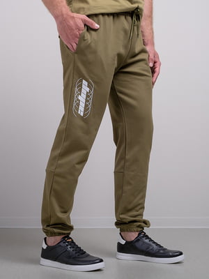 Штани спортивні кольору хакі з принтом | 6519417
