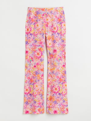 Расклешенные брюки в разноцветный цветочный принт | 6527943