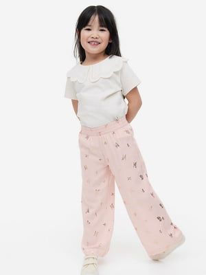 Штани для дівчаток вільного крою рожеві з малюнком | 6589793