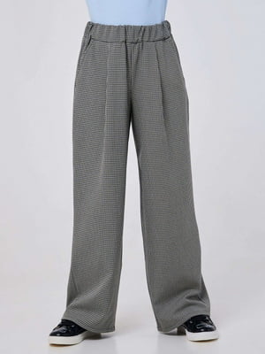 Модные брюки с расширенным к низу кроем и классическим рисунком черно-белой лапки | 6618496