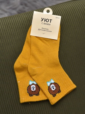 Шкарпетки жовтого кольору | 6685876