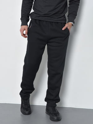 Спортивные штаны на флисе черного цвета | 6686811