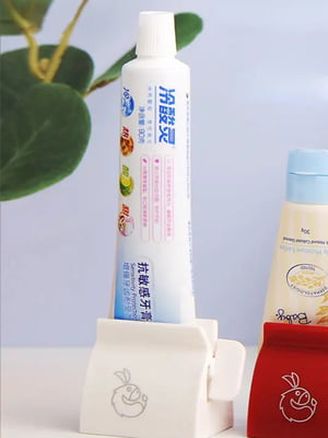 Пресс для выдавливания зубной пасты и крема | 6688613