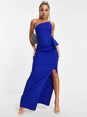 Вечірня сукня синього кольору з розрізом на нозі, відкритими плечима та декорована бантом | 6707226