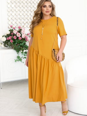 Елегантна жовта сукня А-силуету з асиметрично підшитим подолом | 6721796