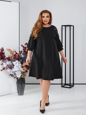 Чорна сукня А-силуету з мереживними вставками на рукавах | 6722329