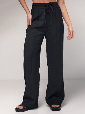 Черные брюки-палаццо на резинке со стрелками | 6736018