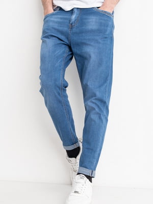 Блакитні звужені джинси з потертостями | 6764157