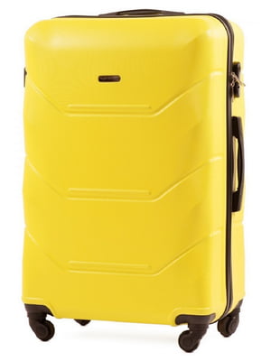 Велика жовта дорожня пластикова валіза на 4-х колесах (86 л) | 6767757