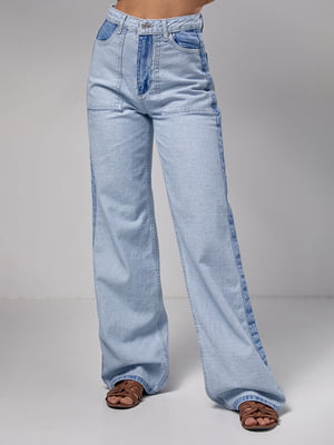Блакитні джинси-кльош з лампасами та накладними кишенями | 6781042