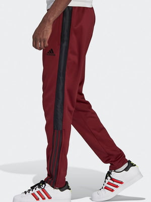 Червоні спортивні штани з чорними смужками та кишенями | 6791369