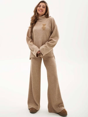 Бежевый шерстяной костюм в рубчик: свитер и брюки-палаццо | 6791153