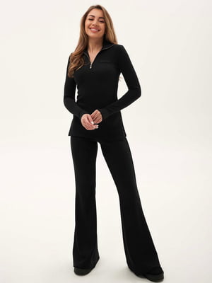 Черный костюм в рубчик: лонгслив и брюки-кльош | 6791154