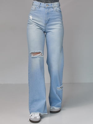 Сині джинси з рваними елементами | 6805583