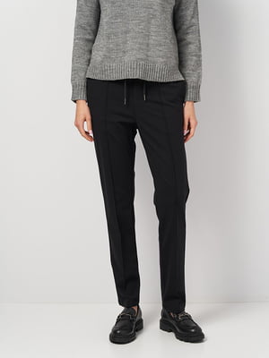 Зауженные черные брюки с акцентными швами | 6811436
