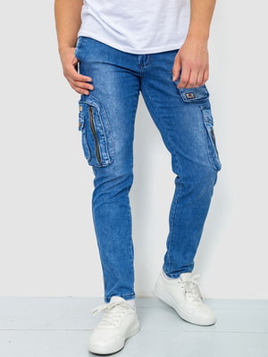 Сині джинси з потертостями та накладними кишенями | 6812523