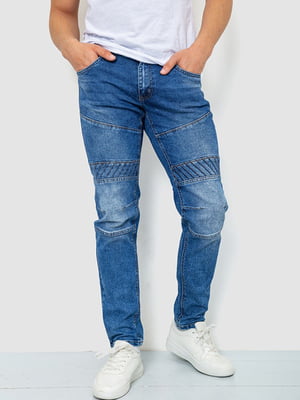 Сині джинси з потертостями та кишенями | 6812531