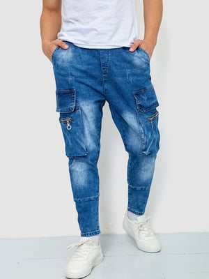 Синие джинсы с потертостями и накладными карманами | 6812536