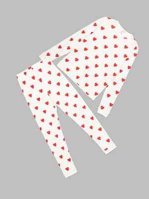 Біла піжама в червоний принт: лонгслів та штани | 6854409