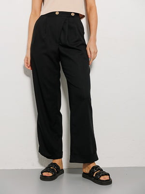 Льняні чорні штани з асиметричною застібкою | 6853415