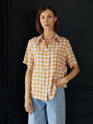 Блуза вільного крою з короткими рукавами помаранчева з принтом | 6862958