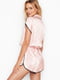 Комбинезон пижамный розовый в принт | 5610574 | фото 2