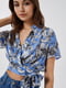 Блуза-топ блакитного кольору з квітковим принтом | 5708596 | фото 3