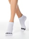 Шкарпетки білі в принт | 5699021