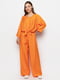 Штани розкльошені оранжевого кольору | 6276073 | фото 2
