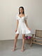 Сукня А-силуету молочного кольору з квітковим принтом | 6398531