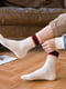 Шкарпетки молочного кольору зі смужками | 6499036 | фото 2