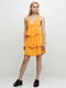 Сукня жовтого кольору, декорована рюшами | 6539273