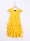Сукня жовтого кольору, декорована рюшами | 6541777