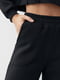 Теплые трикотажные черные штаны | 6547817 | фото 4