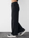 Теплые трикотажные черные штаны | 6547817 | фото 5