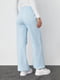 Трикотажные штаны голубые на флисе с накладными карманами | 6547818 | фото 2