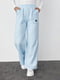 Трикотажные штаны голубые на флисе с накладными карманами | 6547818 | фото 6