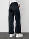Трикотажные черные штаны на флисе с накладными карманами | 6547820 | фото 2