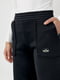 Трикотажные черные штаны на флисе с накладными карманами | 6547820 | фото 4