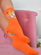 Шкарпетки високі помаранчевого кольору з малюнком | 6576569 | фото 2