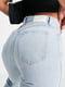 Светло-голубые джинсы с отворотом на поясе и разрезами внизу штанины | 6255494 | фото 4