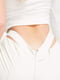 Вузькі штани молочного кольору з вирізами на талії | 6303500 | фото 4