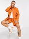 Оранжевая куртка без подкладки на контрастных черных пуговках | 6303516 | фото 2