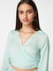 Блуза бірюзового кольору із зав'язками на спині | 6630401