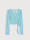 Блуза блакитного кольору в квітковий принт із зав'язками на спині | 6630505