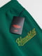 Спортивные зеленые брюки с надписью | 6632427 | фото 2