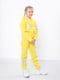 Жовтий підлітковий костюм з принтом: штани та толстовка | 6683413 | фото 2