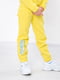 Жовтий підлітковий костюм з принтом: штани та толстовка | 6683413 | фото 4